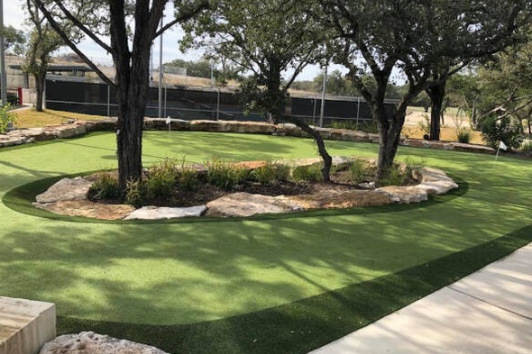 Huntsville residential backyard putting green grass